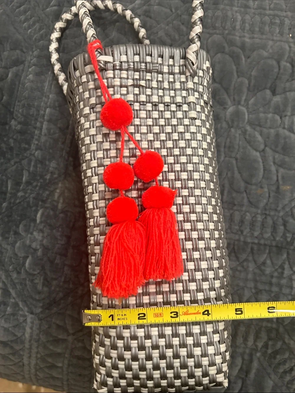 Woven Gray Tote Bag with Red Tassel Accent